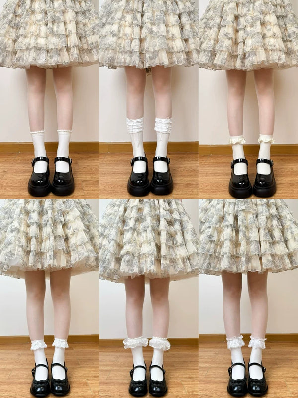 Six styles of lace-trimmed and slouch mid-calf socks shown with black Mary Jane shoes