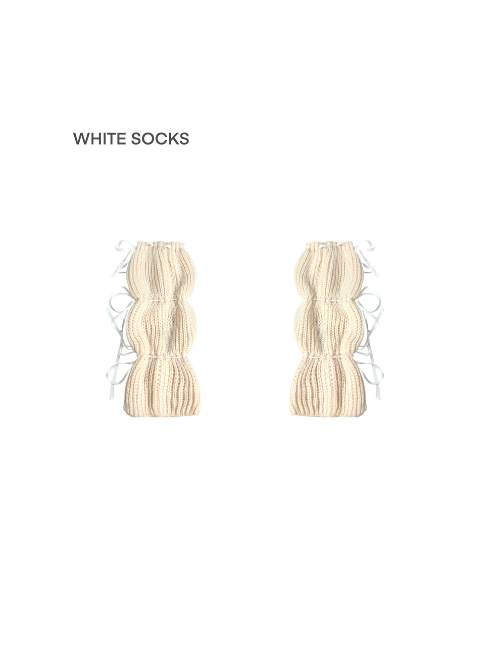 White Socks Wheat knit scrunched socks with multiple ribbon ties, styled with black shoes.