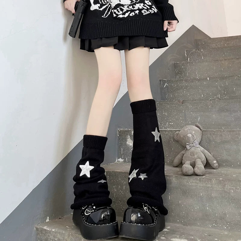 Black slouchy knit leg warmers with white star appliqués