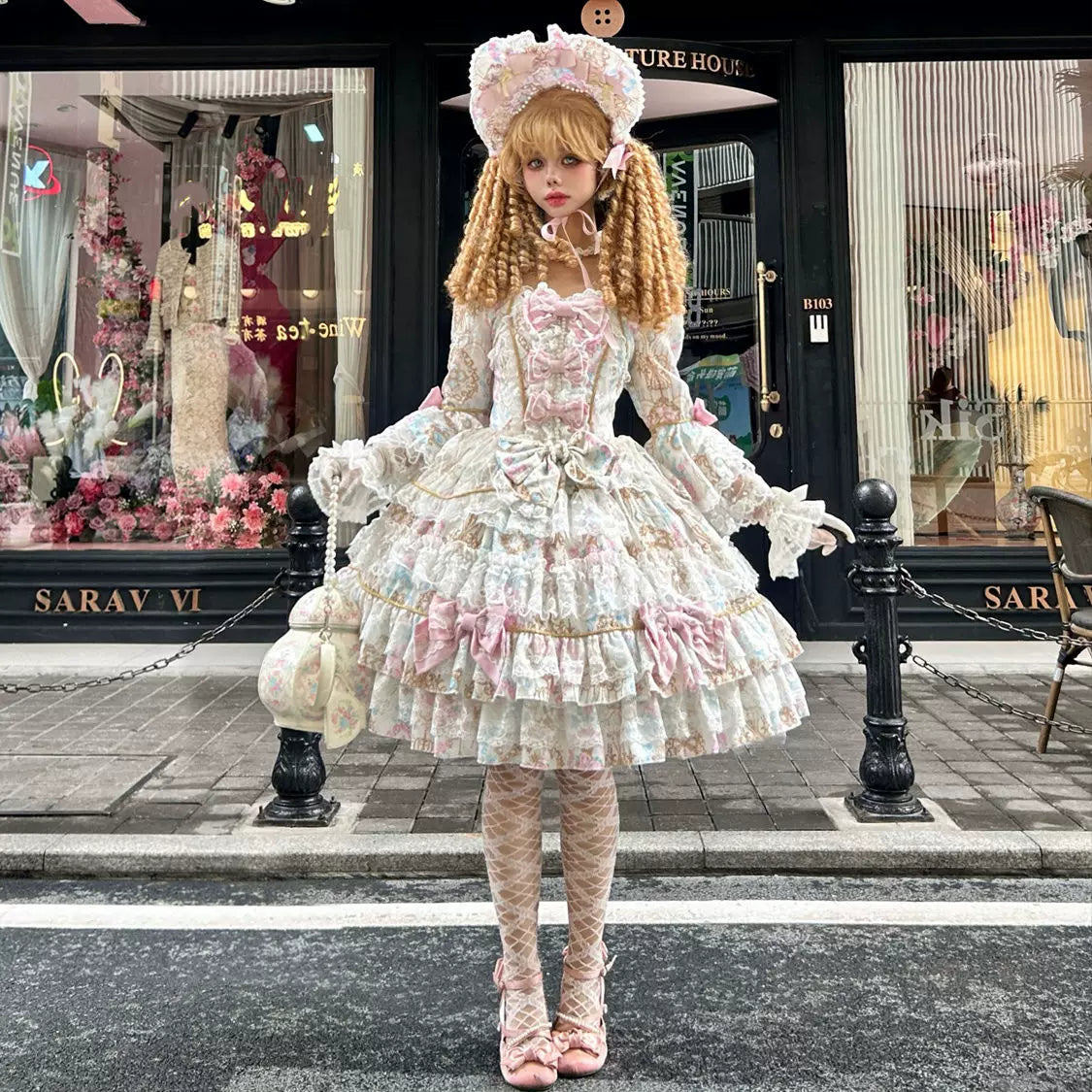 Lady Han Sweet OP dress by Lolita Fetch featuring a candelabra chapter design, displayed on a mannequin with intricate lace details.