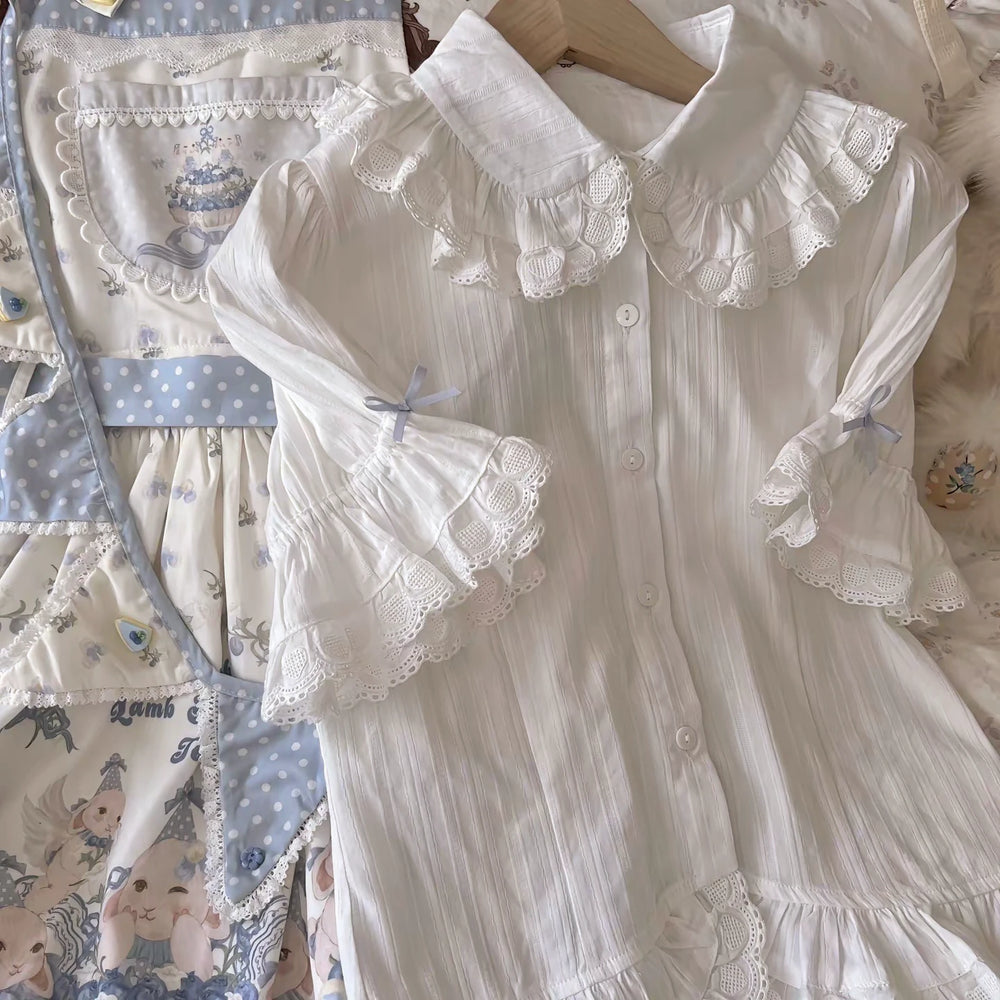 Cream and blue printed JSK with a full skirt and blue polka-dot straps
