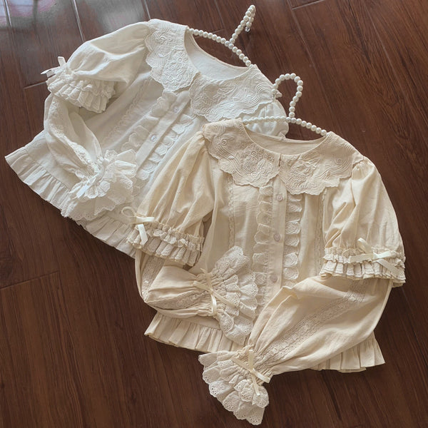 Cream Lolita blouses with ornate lace collars, button fronts, and pleated cuffs.