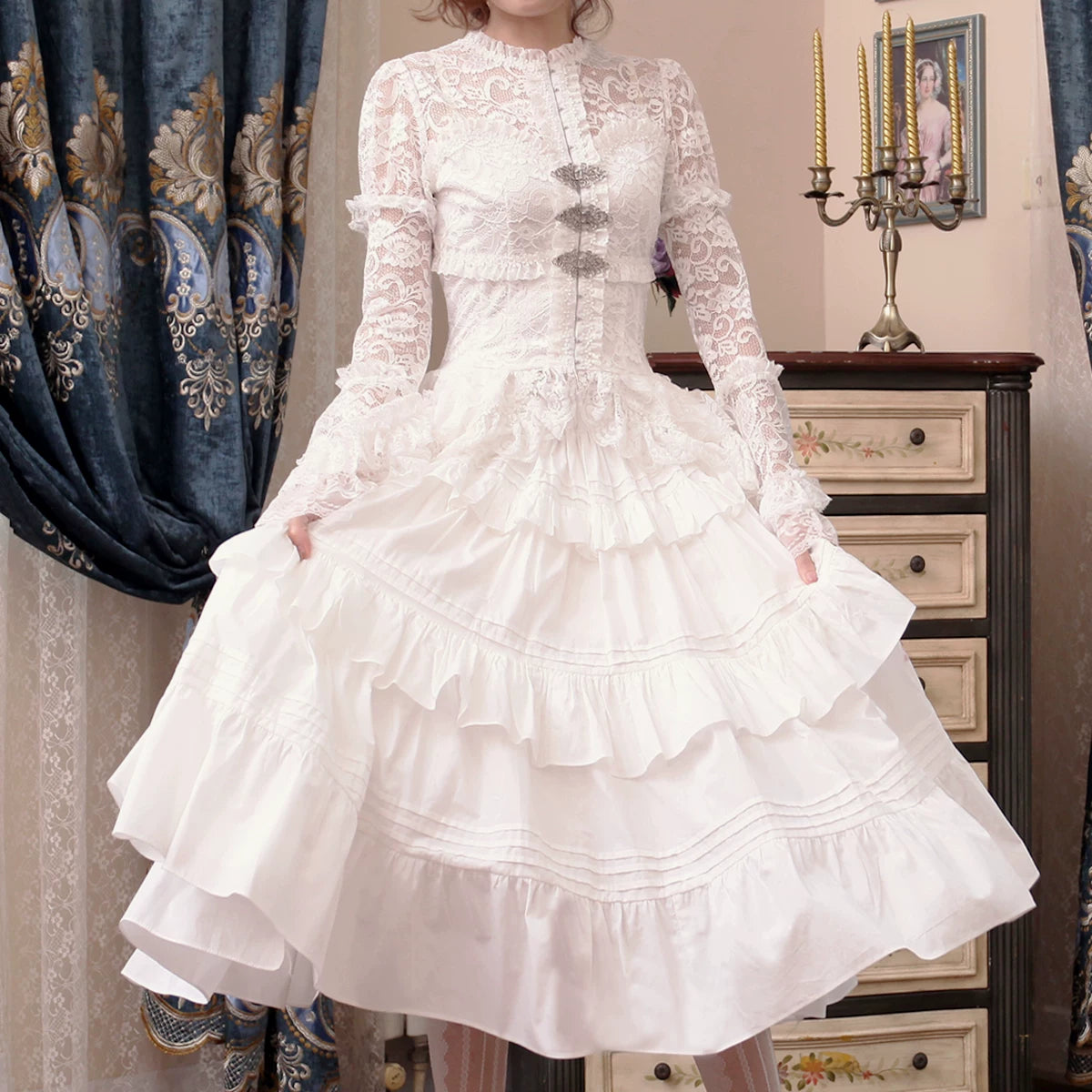 White lace jacket and tiered ruffle skirt worn as a Lolita coordinate