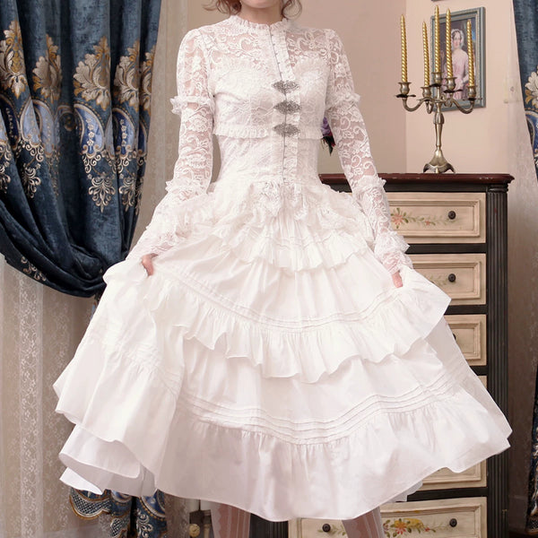 White lace jacket and tiered ruffle skirt worn as a Lolita coordinate