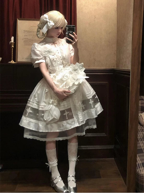 White Gothic Lolita OP dress shown in a mirror photograph.