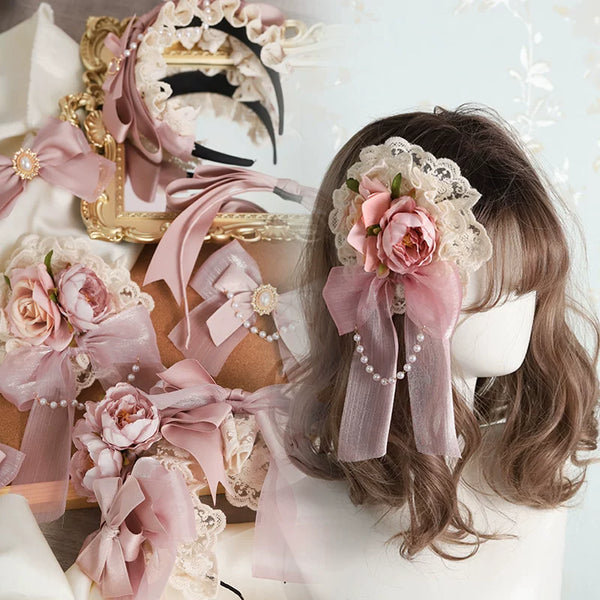 Smoky-pink floral bows, lace hair accessories and a matching headpiece displayed on a mannequin.