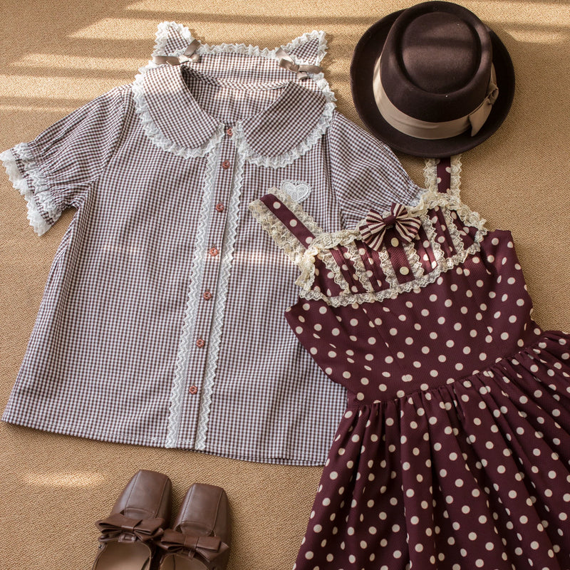 White short-sleeve Lolita blouse with Peter Pan collar, lace trim and button front.