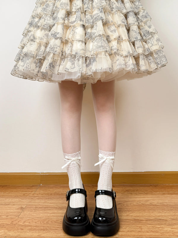 Model-worn lace mid-calf socks with bow detail.