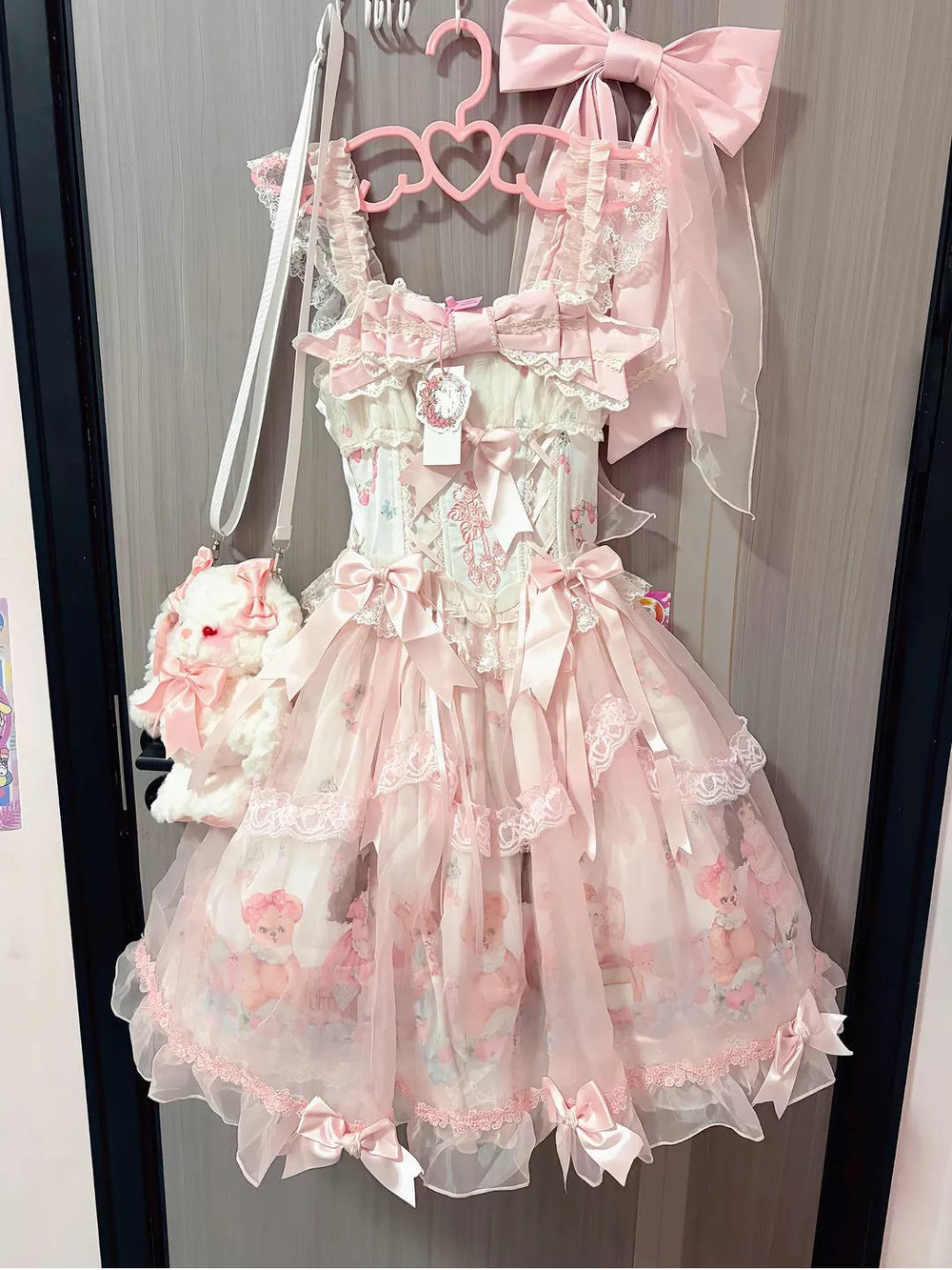 Blush pink Sweet Lolita OP dress with bow accents and tiered tulle skirt