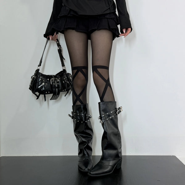 Black crisscross stockings styled with black boots and a short ruffled skirt.