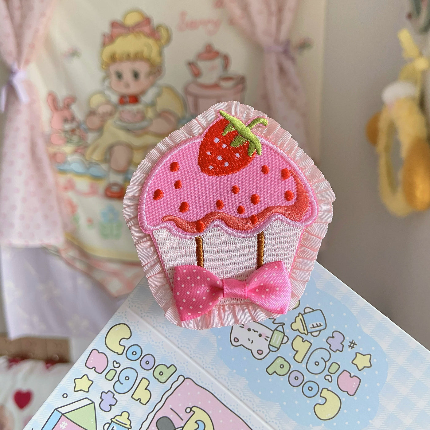Pink strawberry cupcake embroidered brooch and hair clip with ruffled edging and a bow.