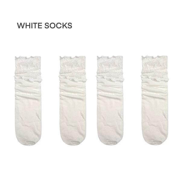 White lace-trimmed mid-calf Lolita socks on plain white background