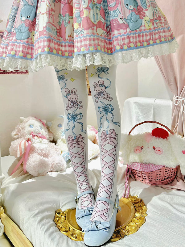 Pastel rabbit-and-ribbon tights worn with a printed skirt and pale blue shoes.