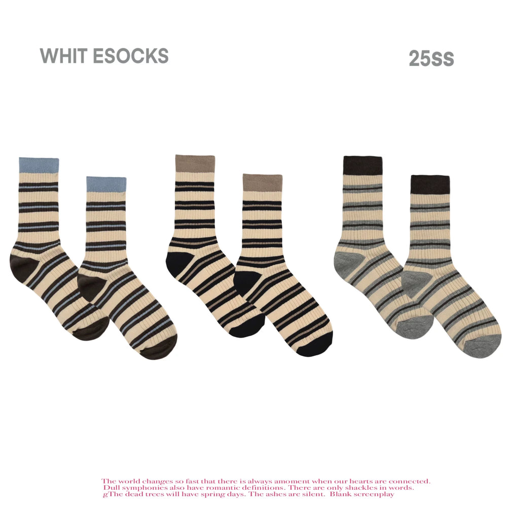 Ribbed cotton crew socks with horizontal brown, beige, and light blue stripes and light blue ribbed cuff