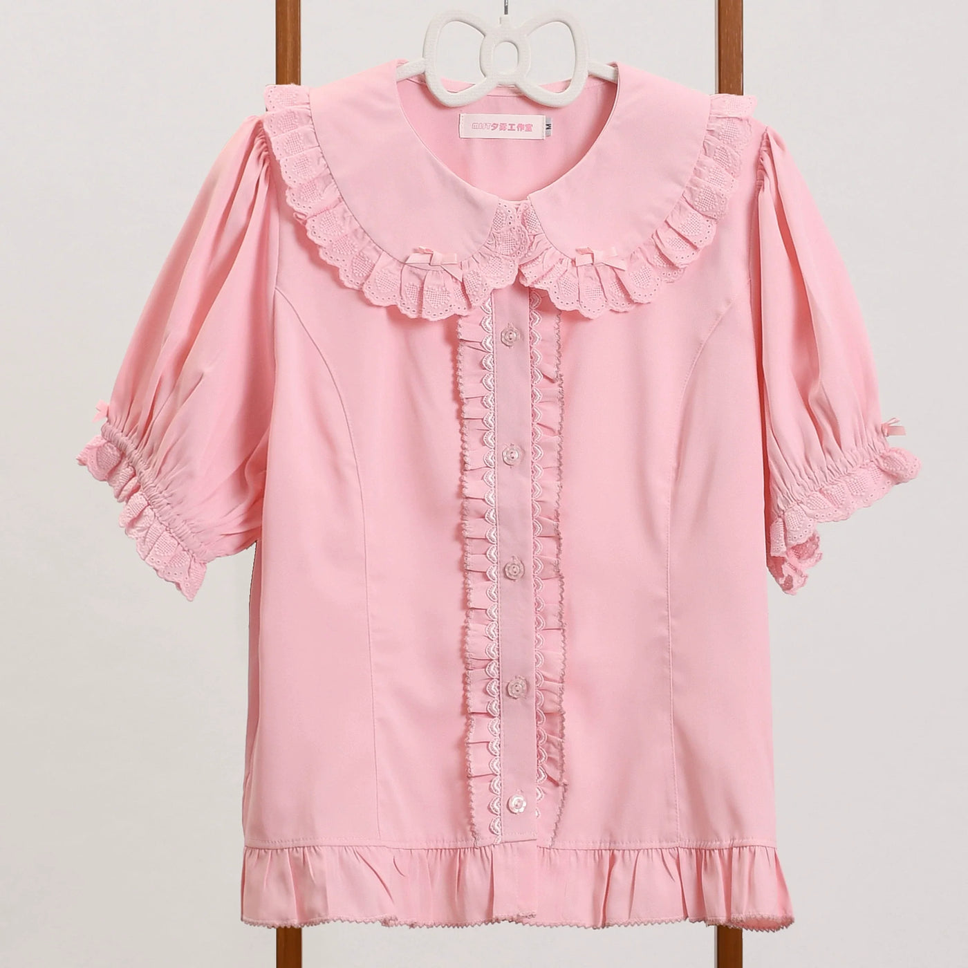 Pink MIST Lolita blouse with Peter Pan collar, lace ruffles, puff sleeves, and button front