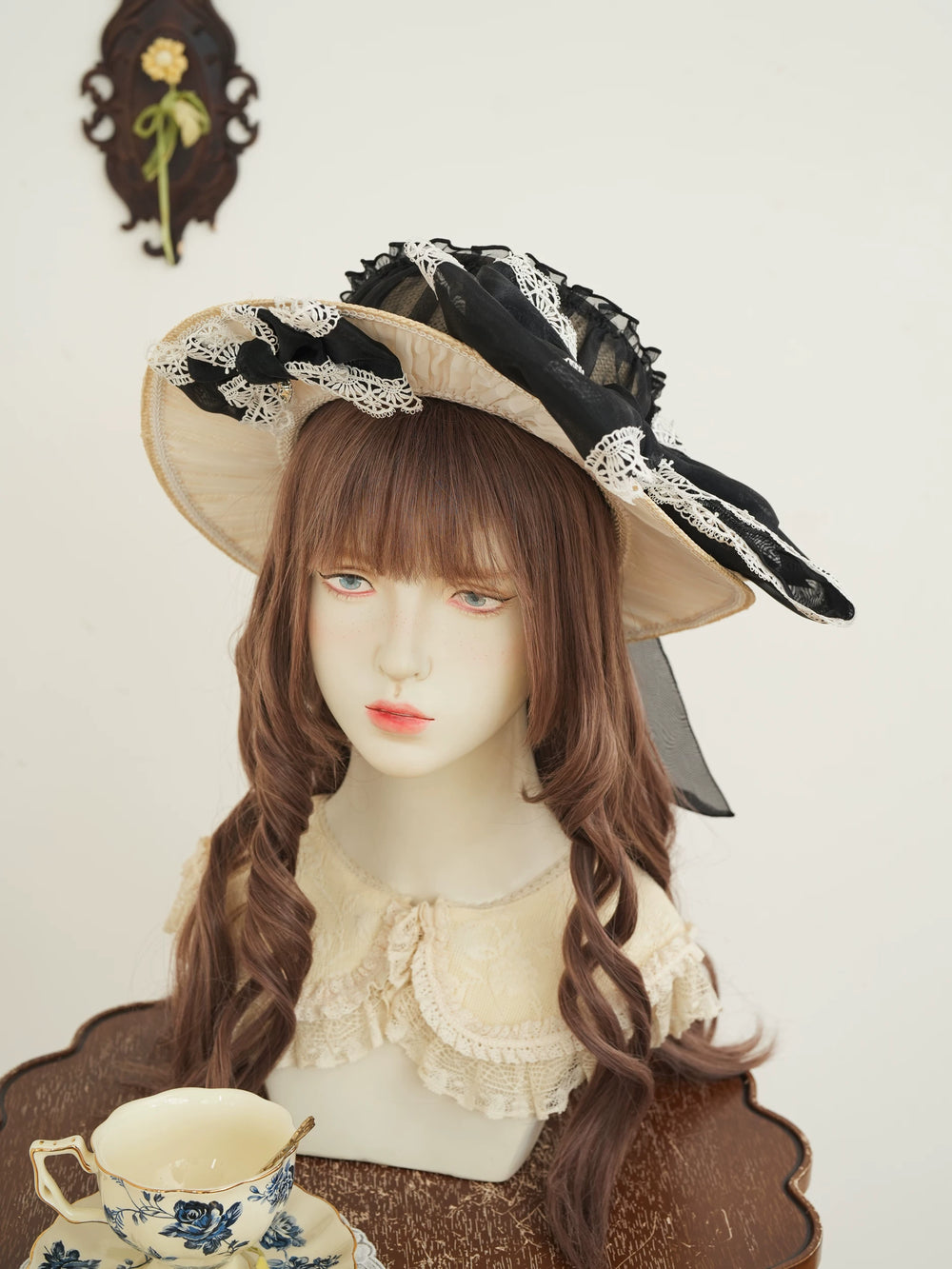 Star Box wide-brim natural straw hat with black lace and bow detail