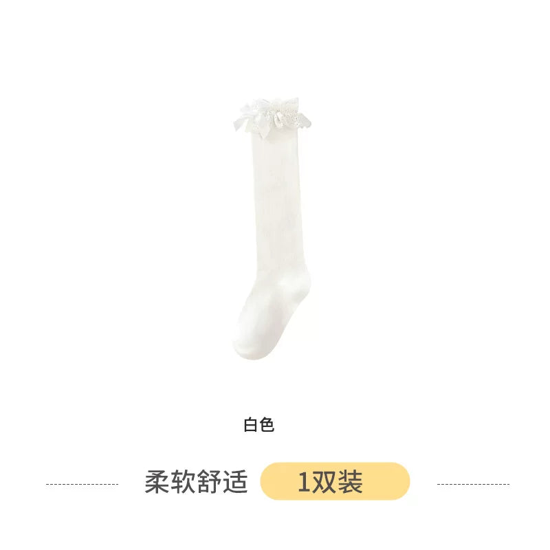 Black calf-length Lolita socks with white lace trim and bow accent, 35cm tube length