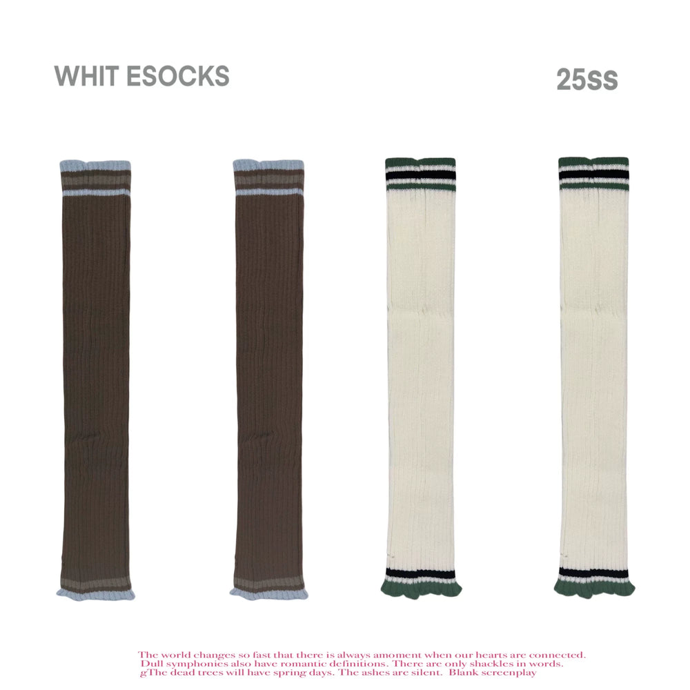 Modelled brown-and-white striped slouch leg warmers with contrast cuffs layered over boots.