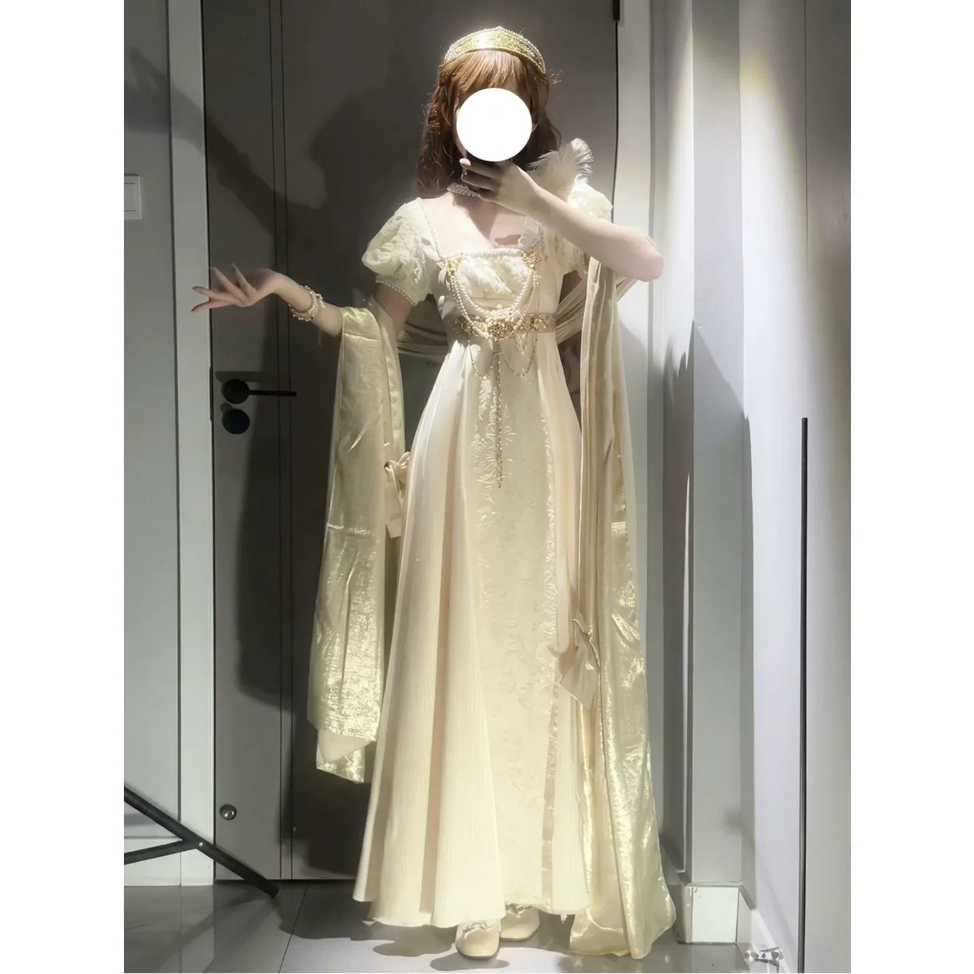 Ivory-gold empire-style Lolita dress with puff sleeves, embossed floral front, gold chains and a long shawl.