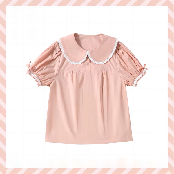 White Sweet Lolita blouse with ruffled Peter Pan collar, puffed short sleeves, and heart embroidery, displayed flat.
