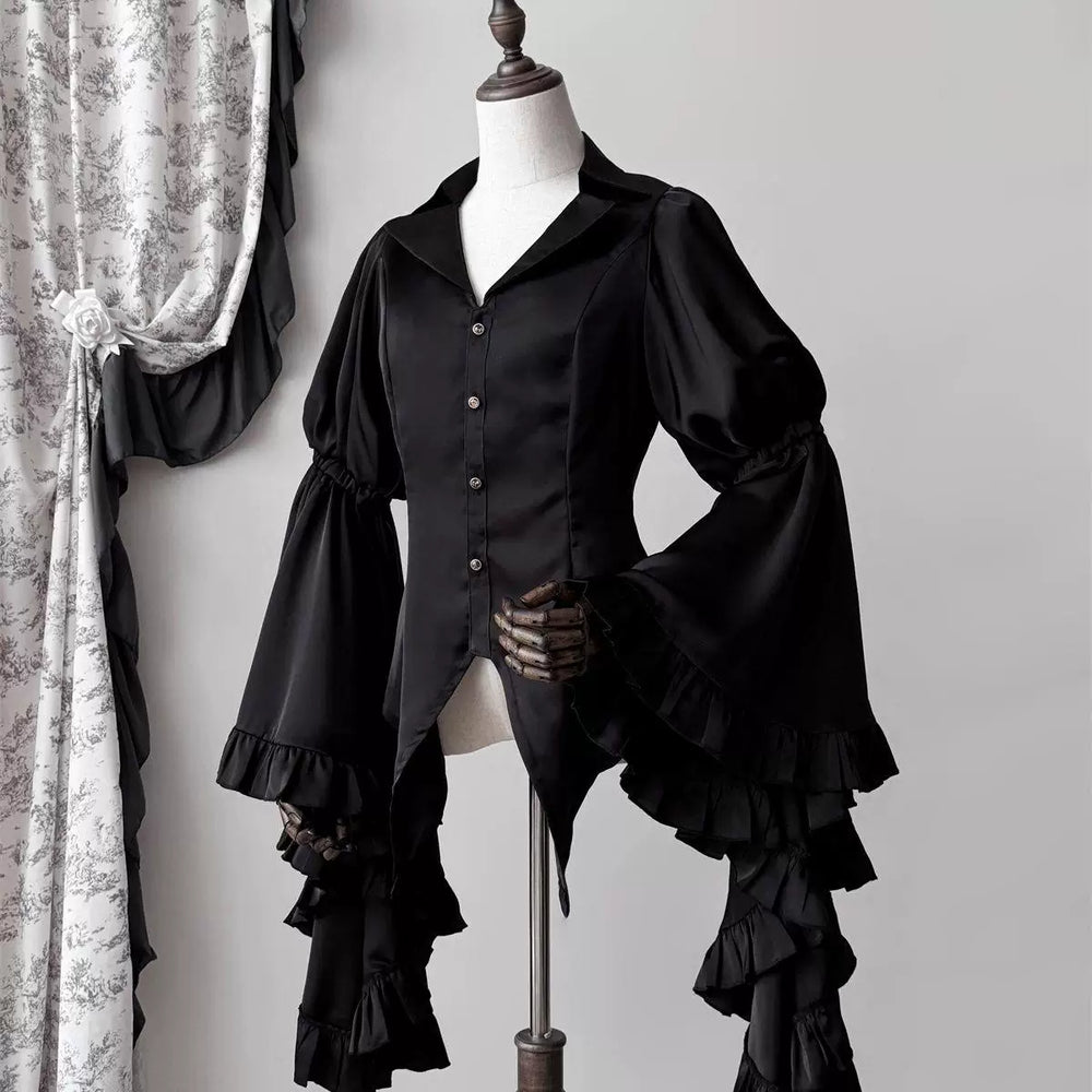 Red V-neck blouse with voluminous tiered ruffle sleeves shown front and back on a mannequin.