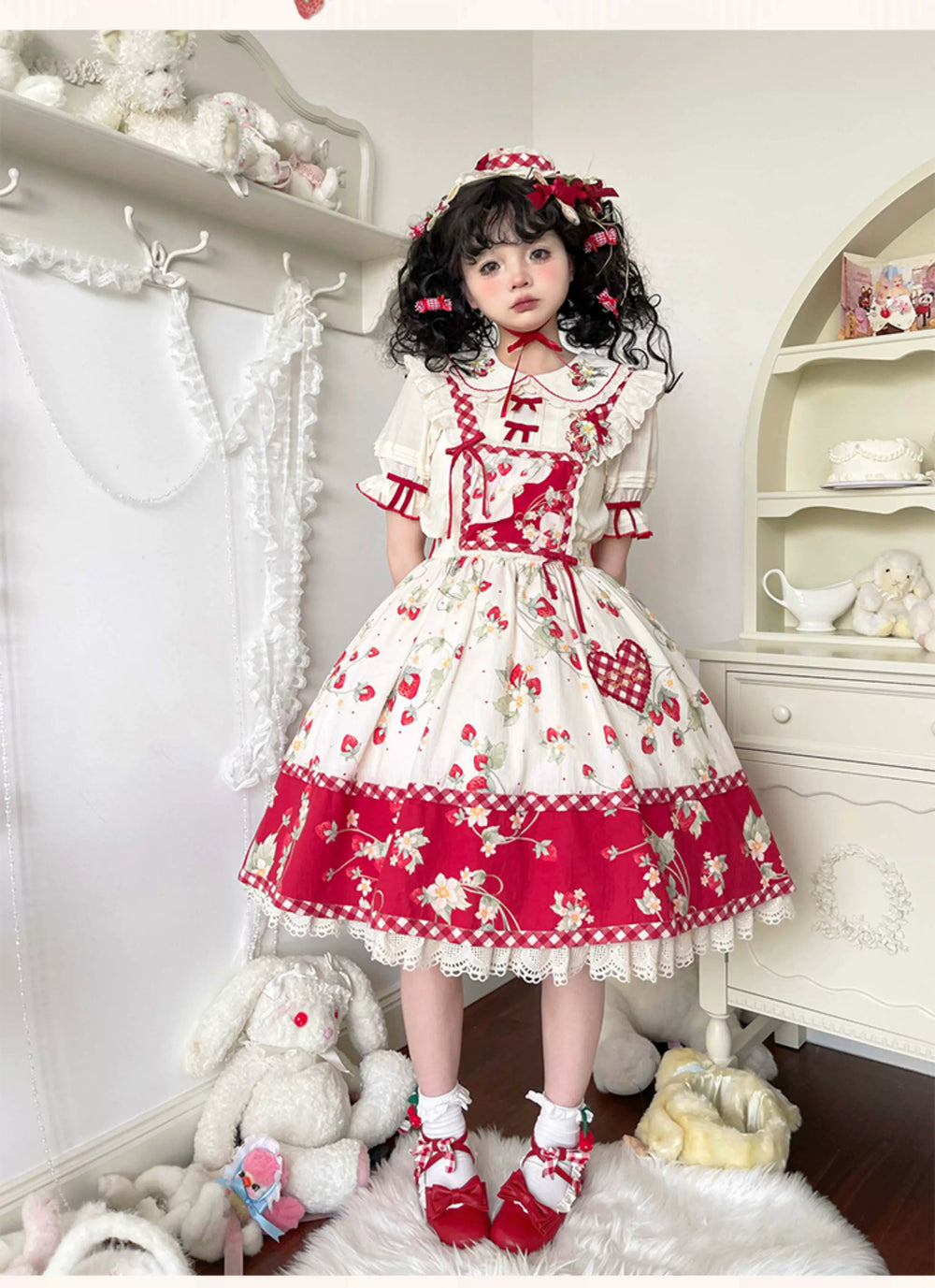 Ivory strawberry-embroidered blouse shown on a model and mannequin