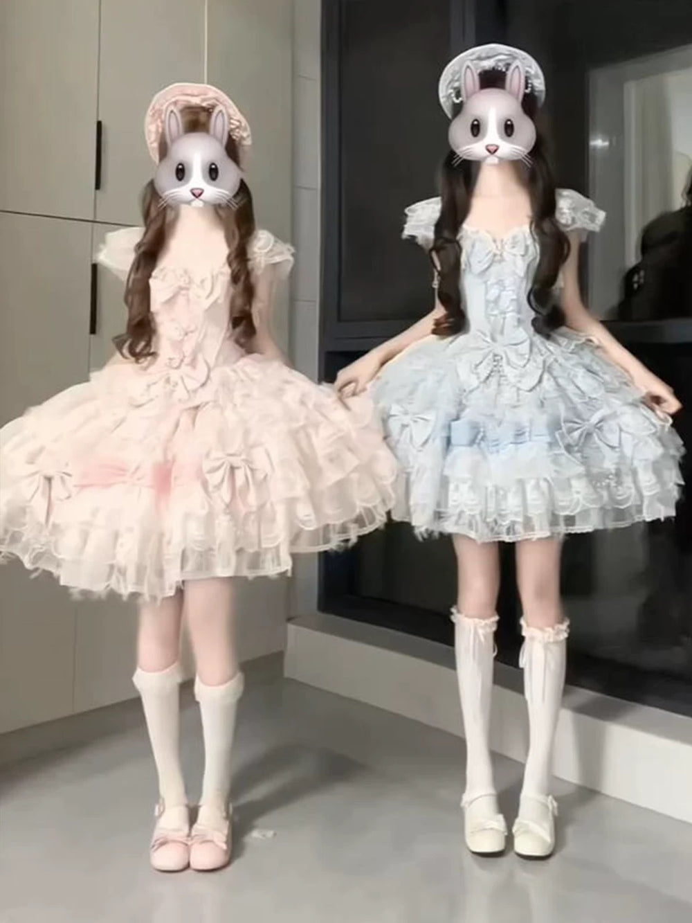 Pink and blue swan-inspired JSK dresses with layered skirts styled on two models