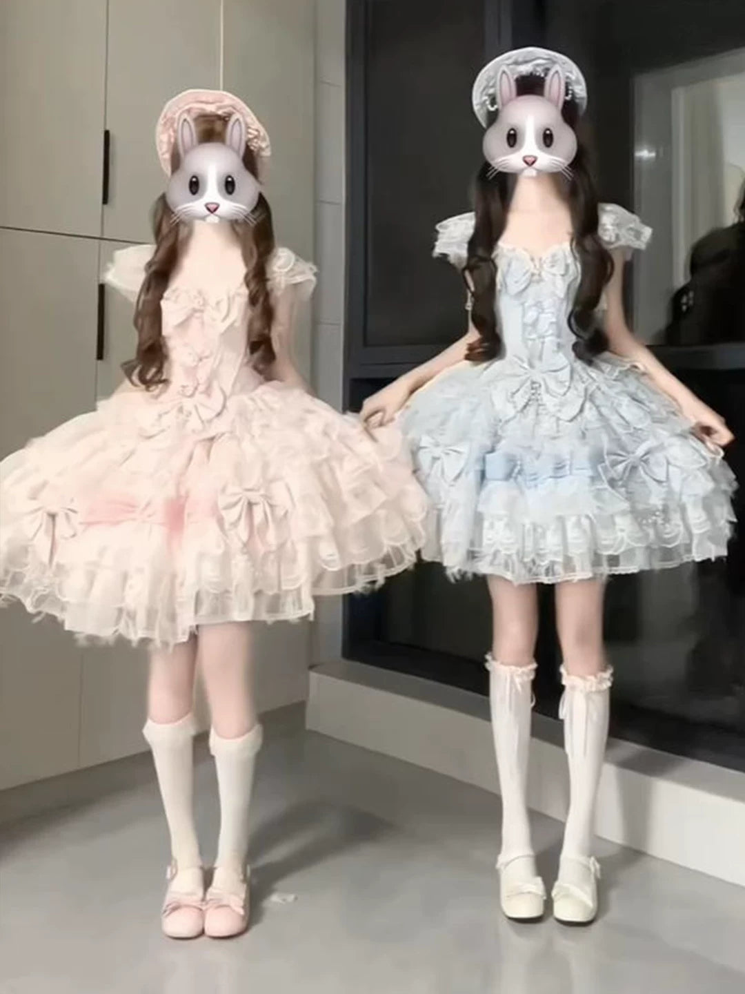 Pink and blue swan-inspired JSK dresses with layered skirts styled on two models
