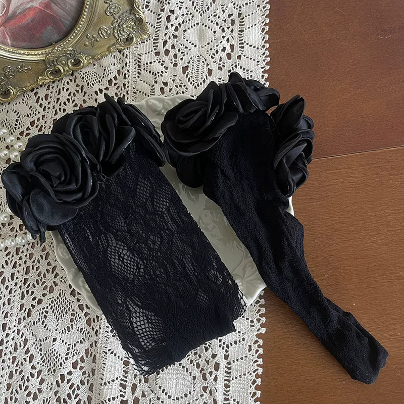 Black ruffled skirt and lace legwear styled with metallic Mary Jane shoes.