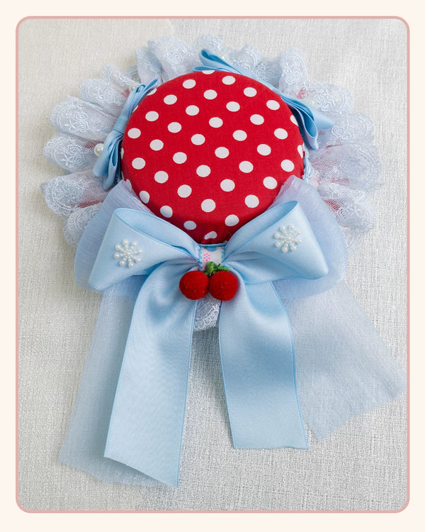 Stardust Rose red polka-dot headwear with ice-blue bows and lace trim