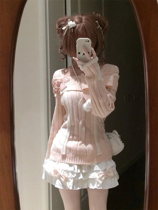 Pink knit top and short white tiered skirt shown in a mirror styling photo.