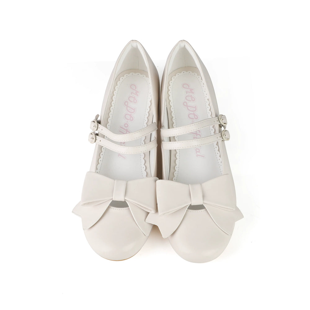 Red pointed-toe Lolita shoes with double straps and oversized bows.