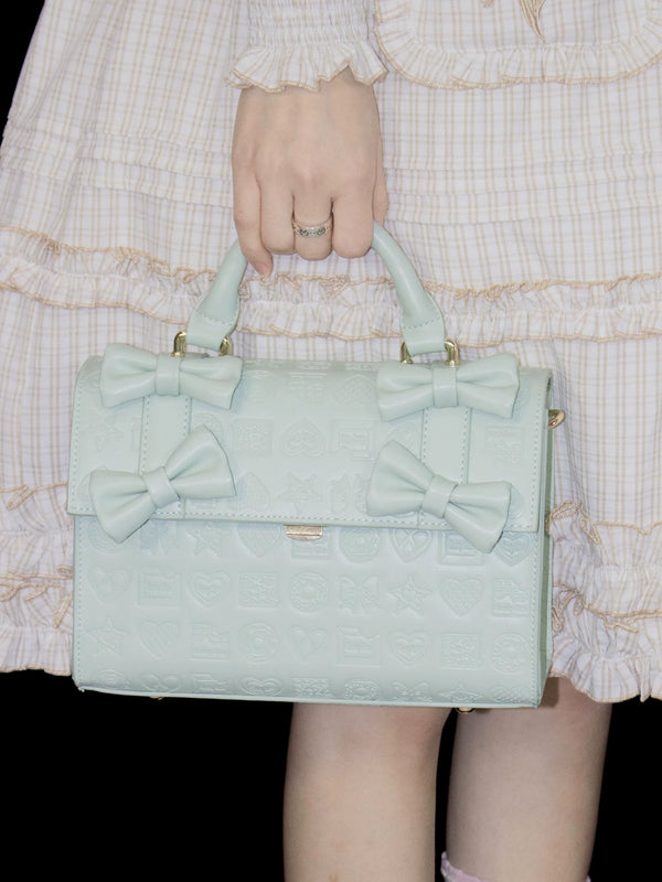 Mint embossed bow bucket bag with multiple front bows