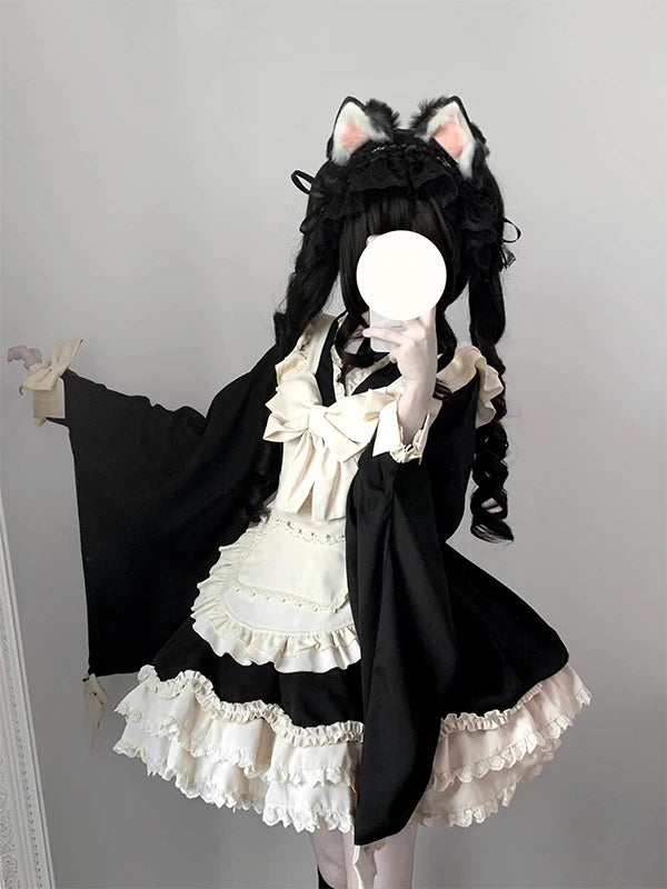 Black-and-ivory Lolita dress and suspender apron set with bows and ruffles.