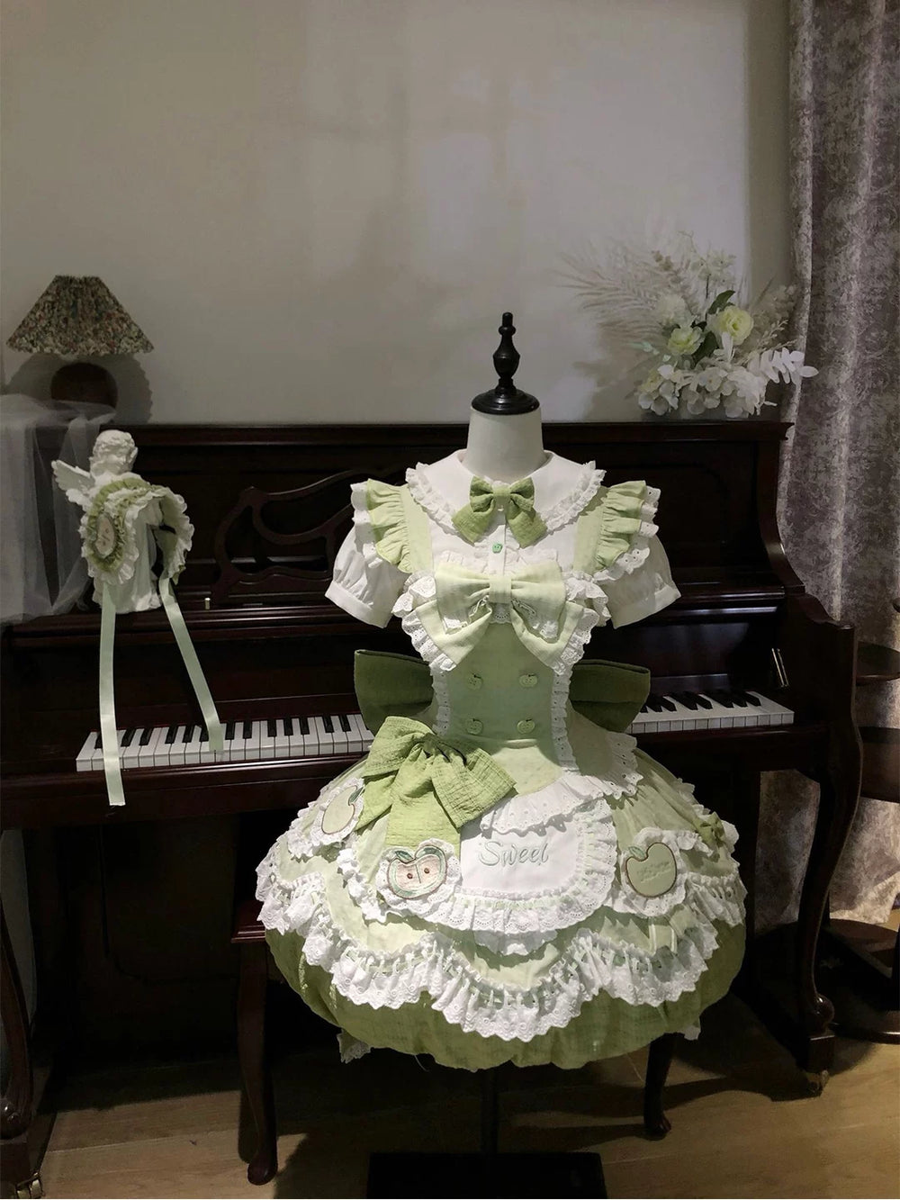 Full view of Creamy sage green and white Sweet Lolita full set with apple motifs and long train