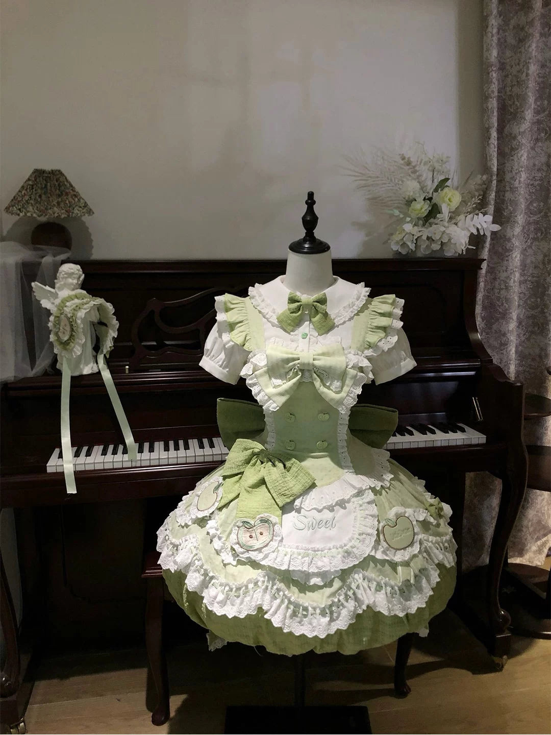 Full view of Creamy sage green and white Sweet Lolita full set with apple motifs and long train