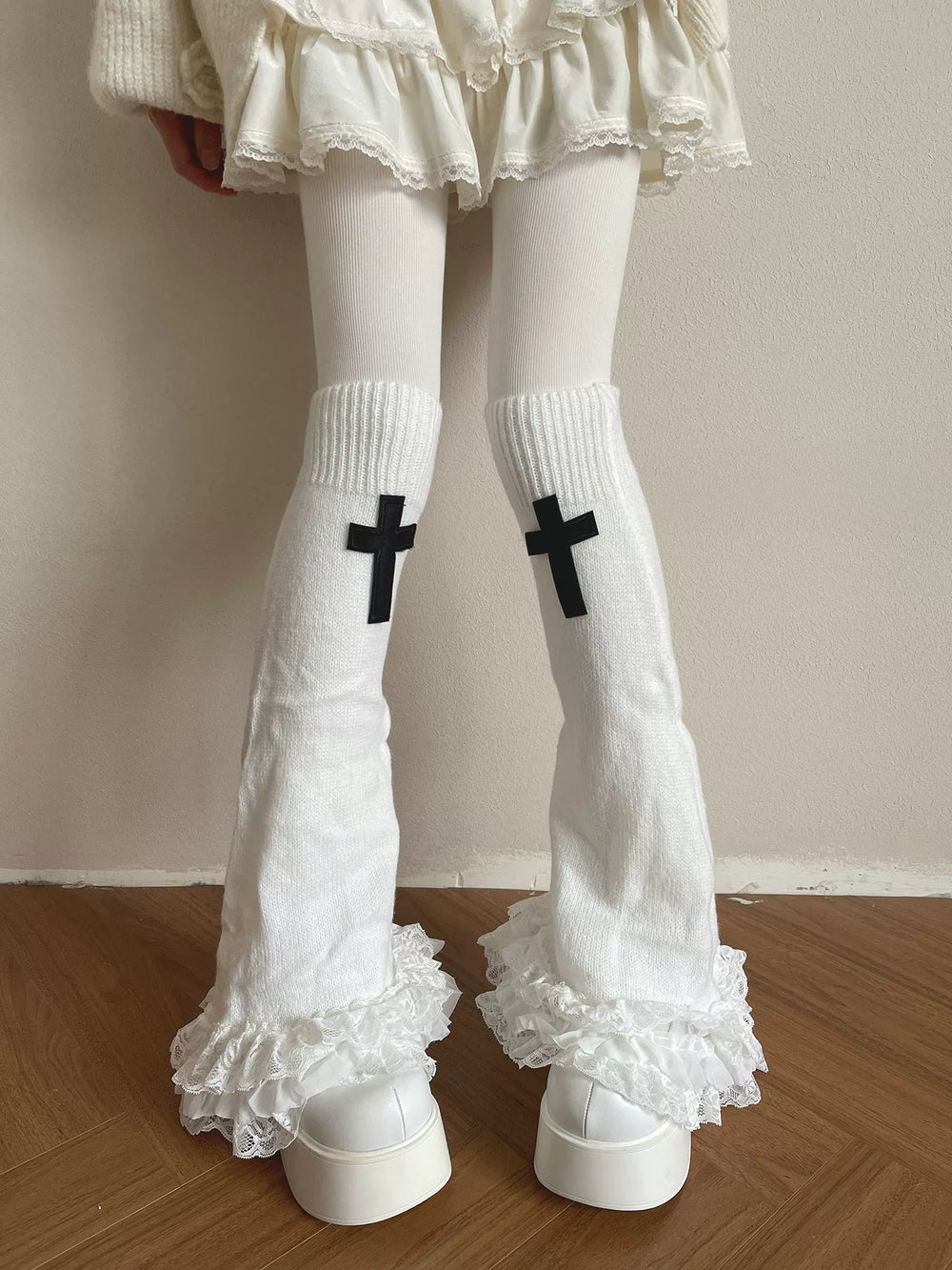 Sock Noble white knit sock covers with black cross motifs and layered lace cuffs