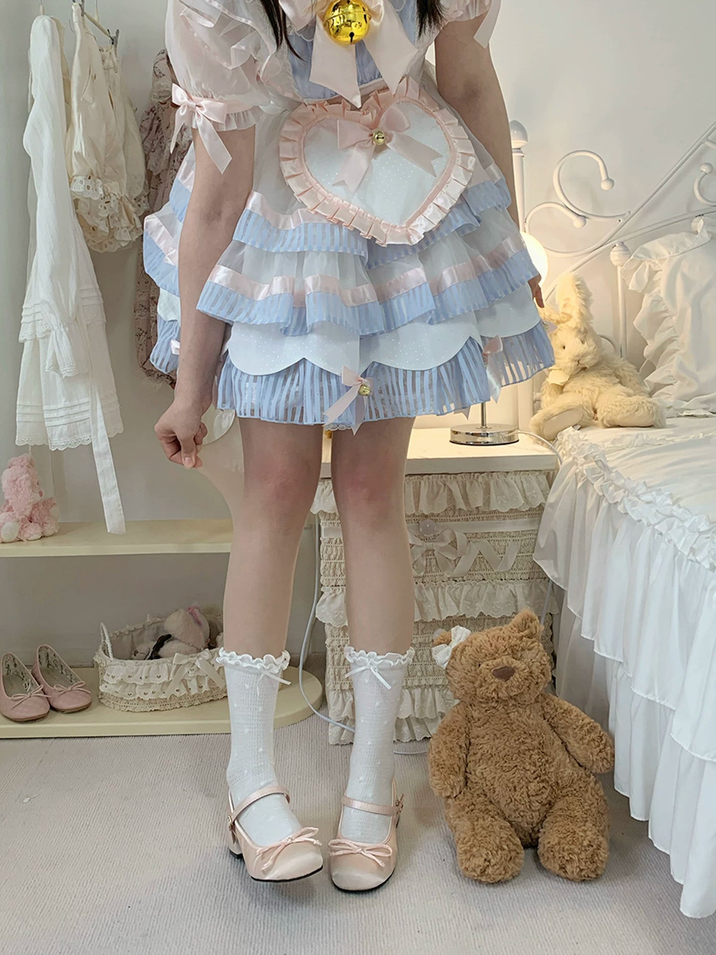 White pantyhose with soft pink knee blush accents worn with a blue ruffled coordinate