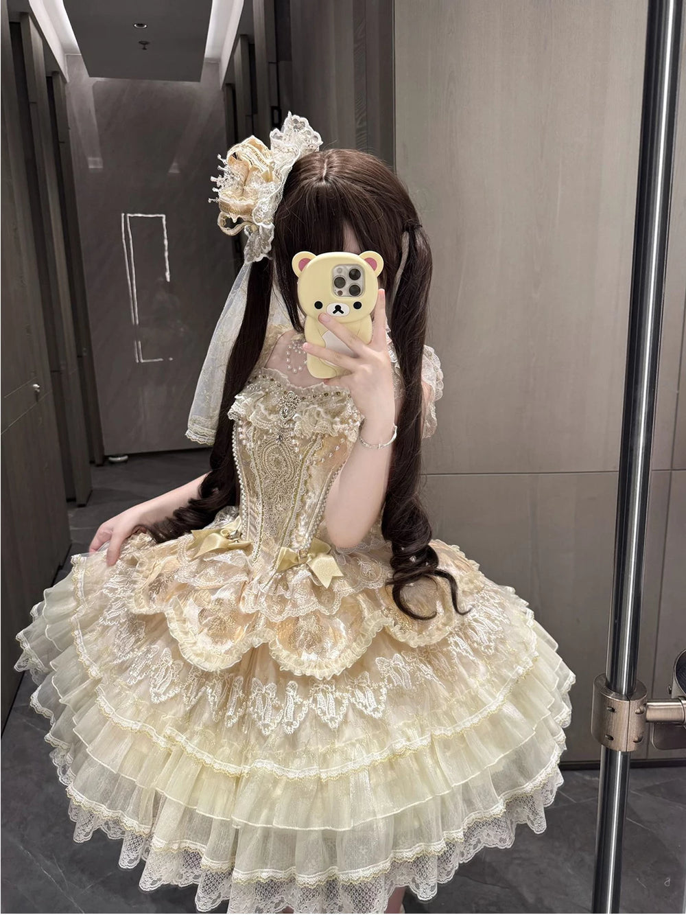 Gold JSK with layered lace ruffles, ribbon bows, and a princess skirt.