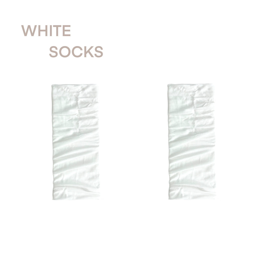 White ribbed footless mid-calf socks with slouchy cuff, styled with black ballet flats for a Lolita look
