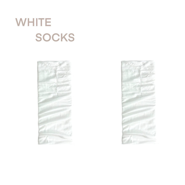 White ribbed footless mid-calf socks with slouchy cuff, styled with black ballet flats for a Lolita look