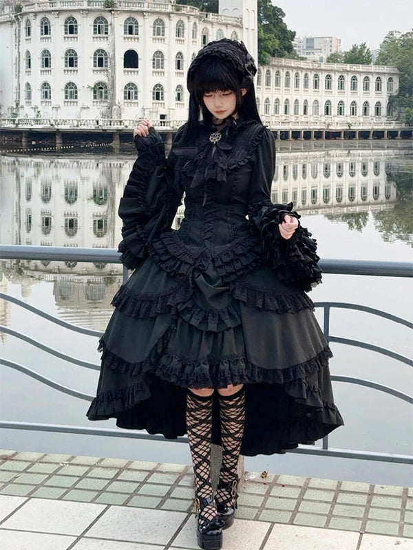 Black gothic blouse and tiered skirt set worn outdoors
