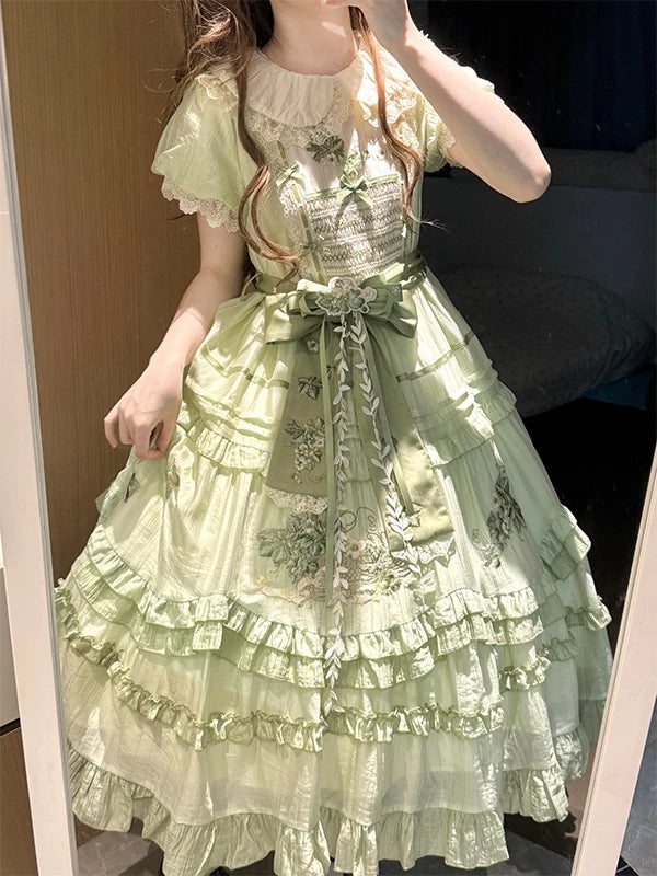 Mint-green embroidered OP dress shown in a mirror outfit photograph.