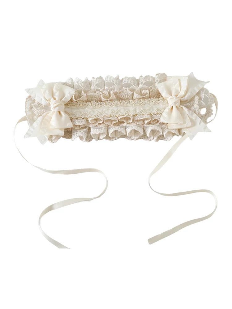 Black layered lace bow headband with a ruffled lace crown.