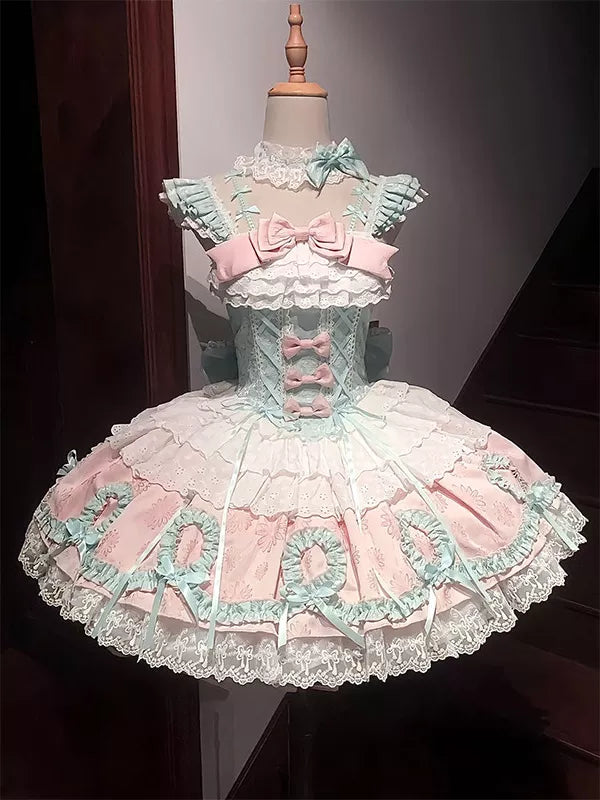 Mint-pink ballet-inspired JSK with bows and lace on a mannequin, front and back views