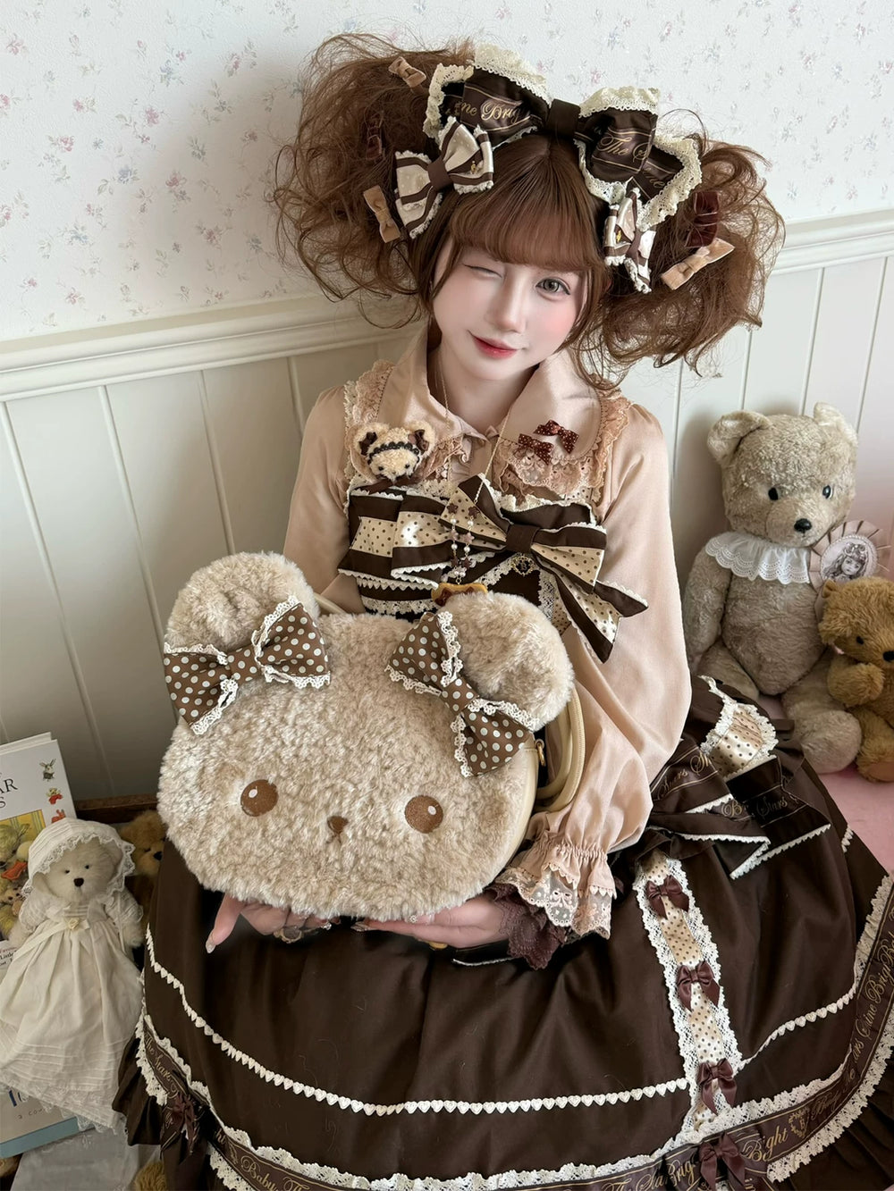 Plush bear-face bag with brown polka-dot bows, shown from front and back.