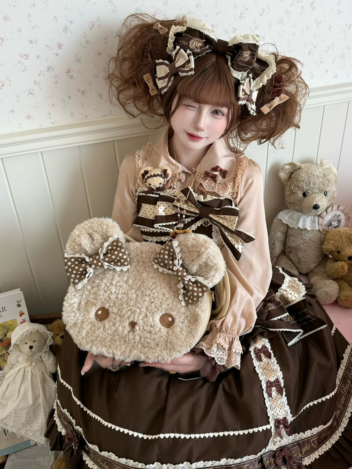 Plush bear-face bag with brown polka-dot bows, shown from front and back.