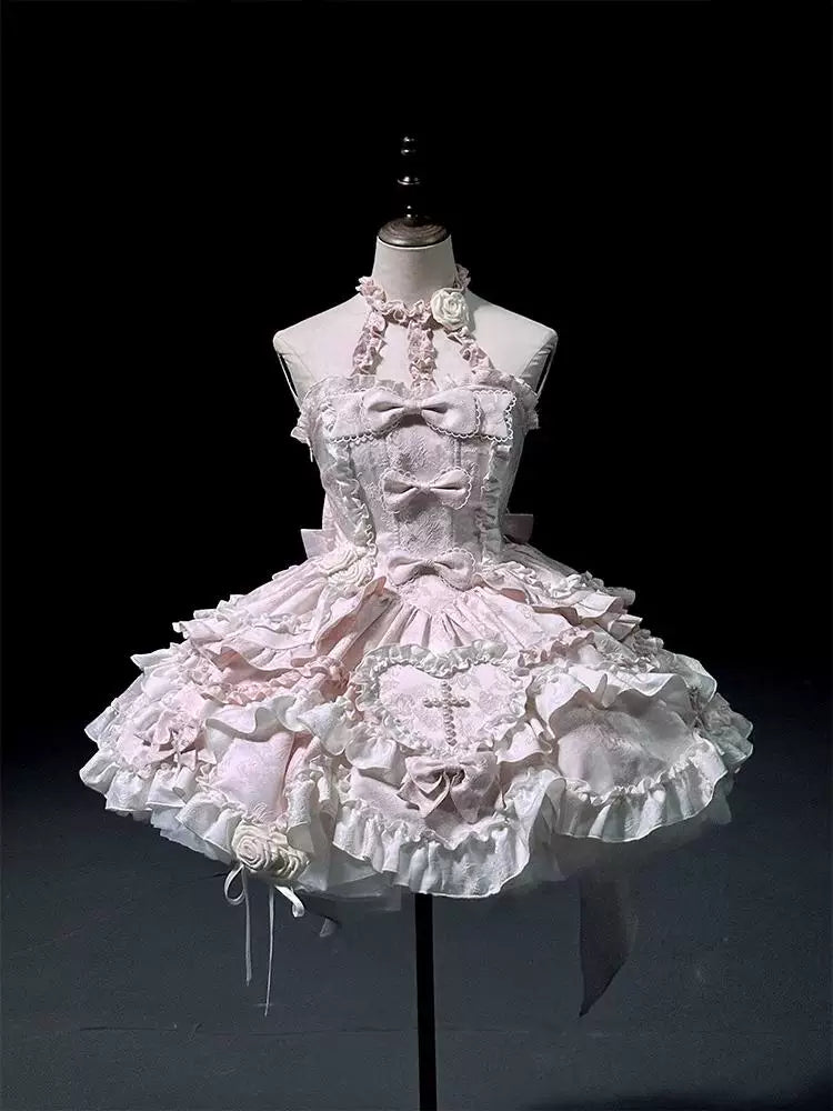 Pink halter-neck JSK dress with layered ruffles on a mannequin