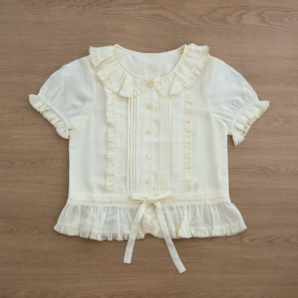 Ivory Sweet Lolita shirt with a ruffled Peter Pan collar, pintucks, and short sleeves.