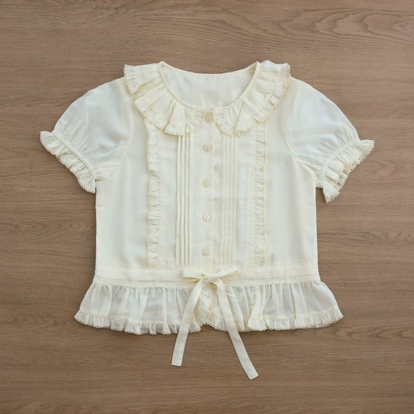 Ivory Sweet Lolita shirt with a ruffled Peter Pan collar, pintucks, and short sleeves.